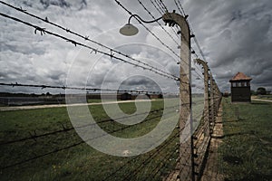 A fence with barbed wire in the Auschwitz 2 Birkenau concentration death camp