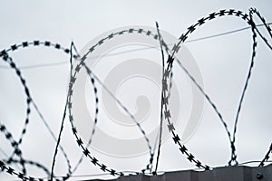 Fence with barbed wire. focus with shallow depth of field.