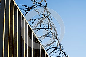 Fence with barbed wire. focus with shallow depth of field.