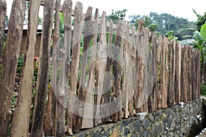 Fence built from wood. Close up of wooden fence. House fence made of wood