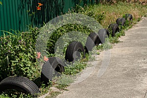 Fence of car tires in the garden