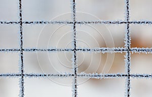 A fence covered in ice and snow
