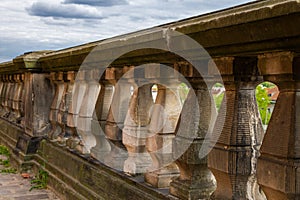 Fence with curly elements. The sky is visible from above.