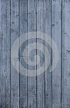 A fence of dark blue and grey turquoise boards