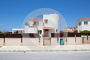 Fence with entrance to villa