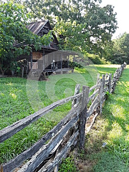 Fence & farmhouse of yesteryear photo