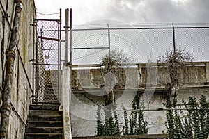 Fence of the federal prison of Alcatraz Island in the middle of the bay of the city of San Francisco, California, USA.