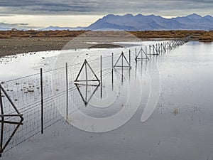 Fence flooded with water after rain