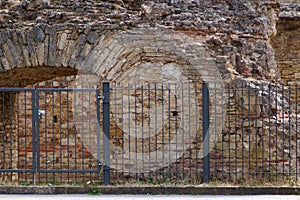 Fence in front of historic walls