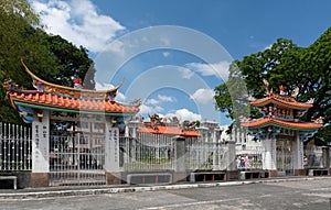 Fence and gates to temple and prayer hall at Chinese Cemetery in Manila Philippines