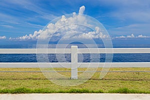 The fence on grassland and cloud blue sky