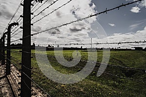 A fence with high voltage barbed wire at the Auschwitz Birkenau 2 death concentration camp