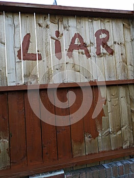 Fence liar neighbour paint stain