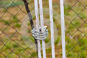 Fence locked with a silver chain.