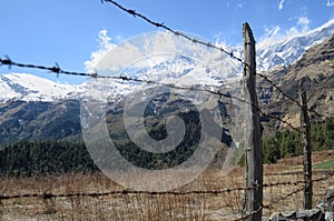 Fence made of barbed wire stopping people to enjoying beauty of nature