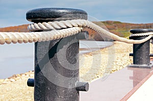 Fence made of obsolete boat chain elements with sea ocean