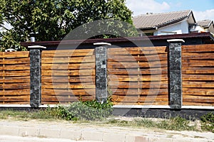 A fence made of wooden interwoven planks