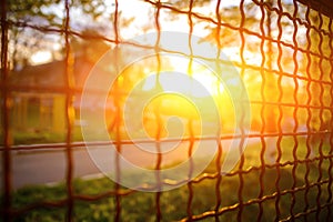 Fence with metal grid in perspective
