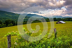 Fence and morning view of mountains in the rural Potomac Highlands of West Virginia.