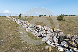 Fence of old traditional stone wall