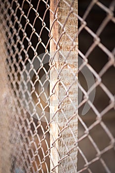 A fence of rusty metal mesh