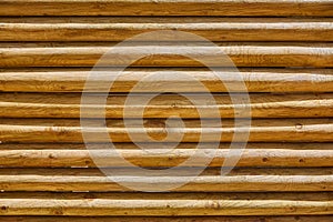 Fence of stacked round trunks wood pattern