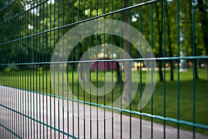 Fence at thw public park at summer day