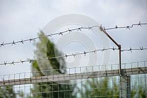 fence with two rows of barbed wire