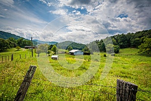 Fence and view of a farm in rural Shenandoah Valley of Virginia.