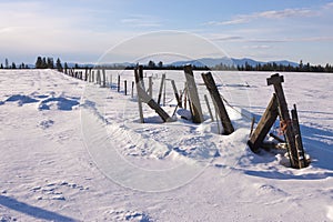 Fence in winter on a sunny day.