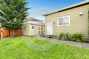 Fenced backyard with small shed