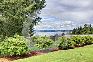 Fenced backyard with water view