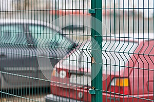 Fenced car parking lot with security