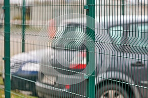 Fenced car parking lot with security