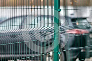 Fenced car parking lot with security