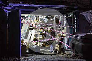 Fenced garage at the crime scene, background blurred with bokeh effect