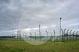 Fenced Landfall station of nord stream 2 in Lubmin near Greifswald under a cloudy sky, gas pipeline through the Baltic Sea from photo