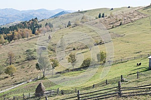 Fenced private property on a hill. Ukrainian village in Carpathians