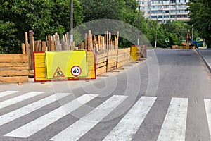 Fenced section of city street during of a roadworks