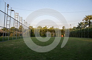 Fenced soccer fiels or handball field with lights