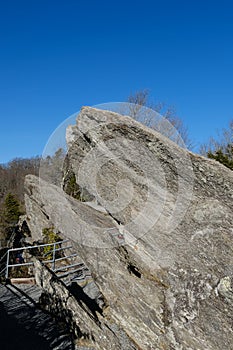 Fenced Trucking path to mountain with blue sky background