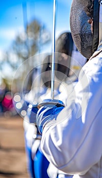 Fencers foil and saber blades in action, highlighting precision and skill with copy space.