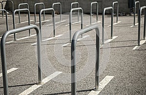 Fences linearly arranged in a public parking for bicycles and motorcycles
