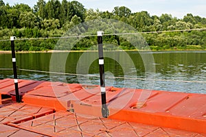 Fencing on the dock by the river