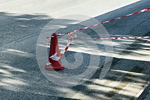 Fencing red and white tape, which prohibits movement. Warning, police tape. photo