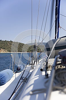 Fender buoys on sailboat side with ropes