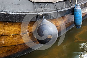 Fenders on a traditional wooden ship