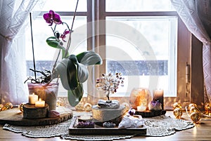 Feng Shui nature theme altar at home table and on window sill. photo