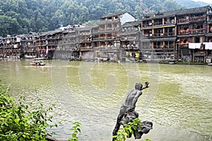 Fenghuang ancient town china and Tuo jiang river tourist boats