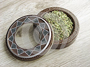 Fennel seeds spice vecto into handcraft box photo